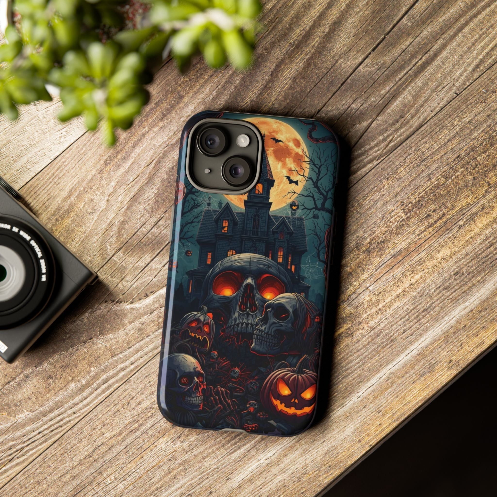 Spooky Halloween Phone Case with Skulls, Pumpkins, and Haunted Mansion